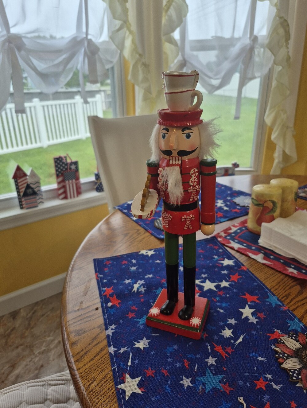 Festive Red Nutcracker Soldier Figurine with Teacup Stack